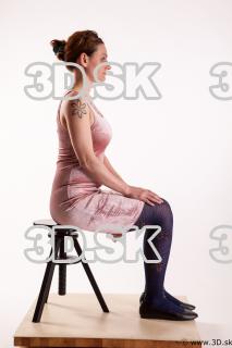 Sitting reference of whole body pink dress purple tights black…